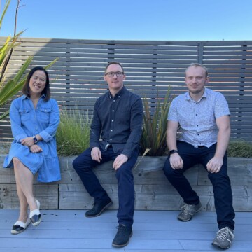 our team of experienced architects sitting outside